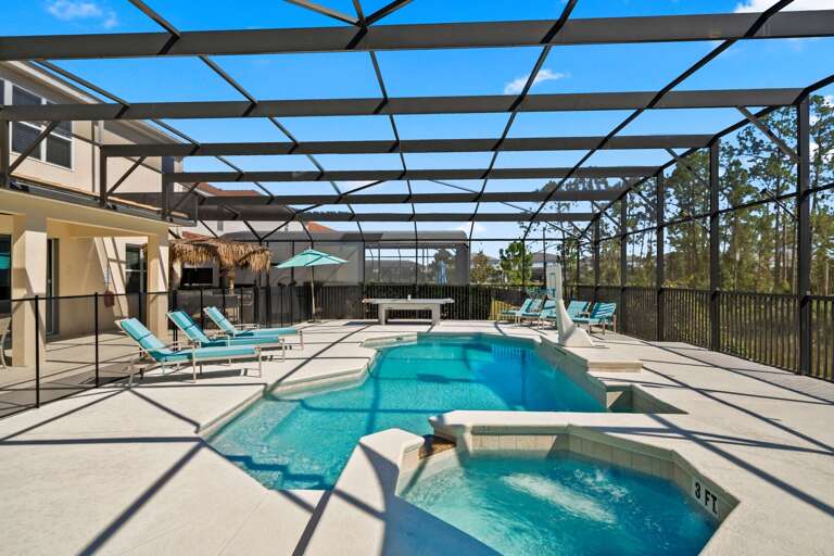 Pool and spa area with Ping-Pong table and Tiki bar
