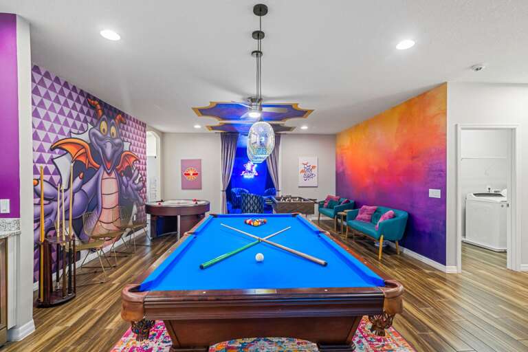 Game room with pool table, air hockey, foosball, and wet bar