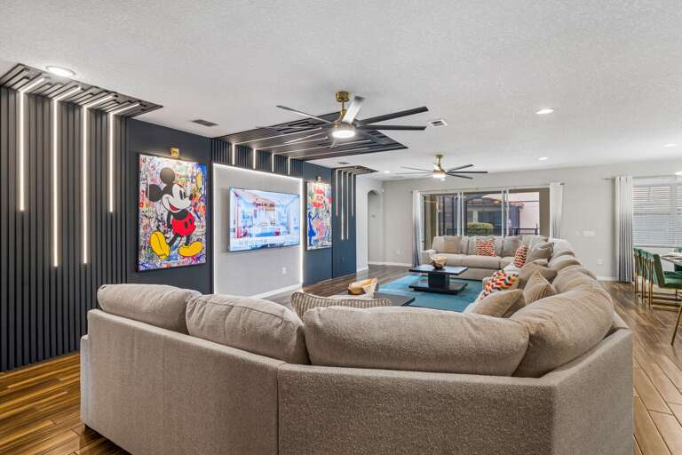 Living area with huge sectional sofa and flat-screen TV