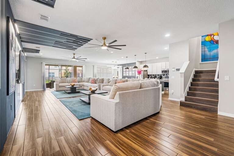 Living area with huge sectional sofa and flat-screen TV