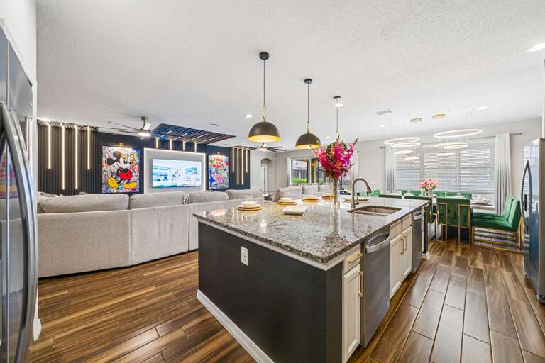 Spacious kitchen with large island and stainless-steel appliances