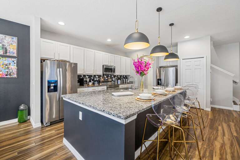 Spacious kitchen with large island and stainless-steel appliances