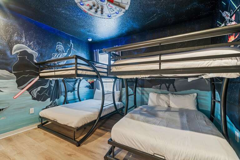 Star Wars themed bedroom with dual Full over Full bunk beds