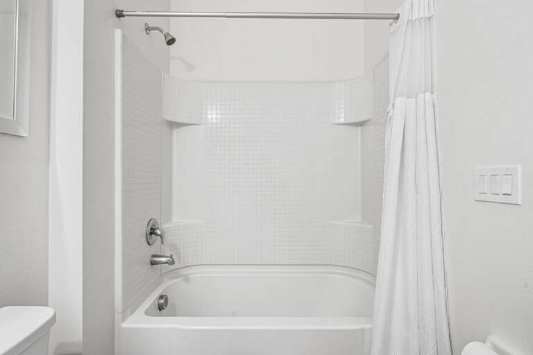 Bathroom w/ bath and shower combo Bathroom w/ bath and shower combo