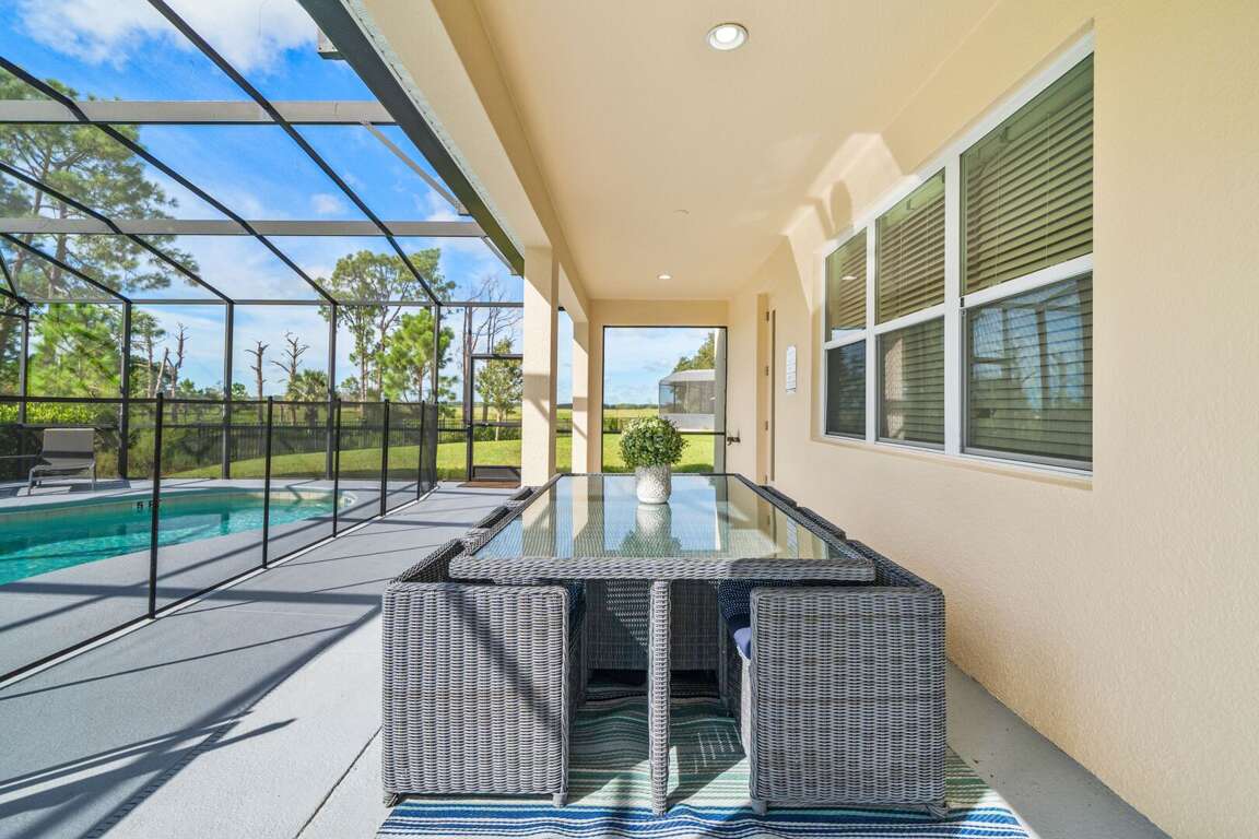 - Covered patio with outdoor dining by the pool  
- Orlando family vacation villa with modern seating  
- Lakeside villa rental near Disney with screened lanai - Covered patio with outdoor dining by the pool  
- Orlando family vacation villa with modern seating  
- Lakeside villa rental near Disney with screened lanai