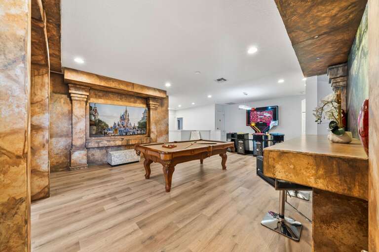 - Lounge area with sectional sofa and castle decor walls  
- Orlando family villa with fun entertainment areas  
- Vacation rental close to Disney with spacious lounge - Lounge area with sectional sofa and castle decor walls  
- Orlando family villa with fun entertainment areas  
- Vacation rental close to Disney with spacious lounge