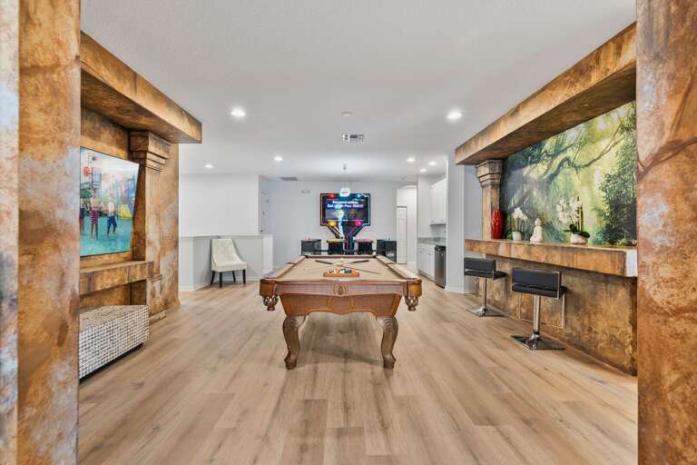 - Themed lounge area with custom mural and bar  
- Large Orlando vacation rental with movie theater  
- Perfect villa for family reunions near Disney - Themed lounge area with custom mural and bar  
- Large Orlando vacation rental with movie theater  
- Perfect villa for family reunions near Disney