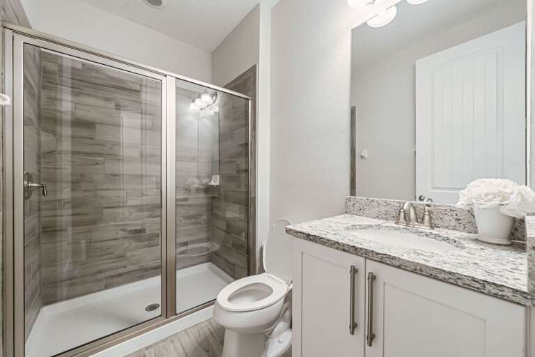 Bathroom with glass enclosed shower Bathroom with glass enclosed shower