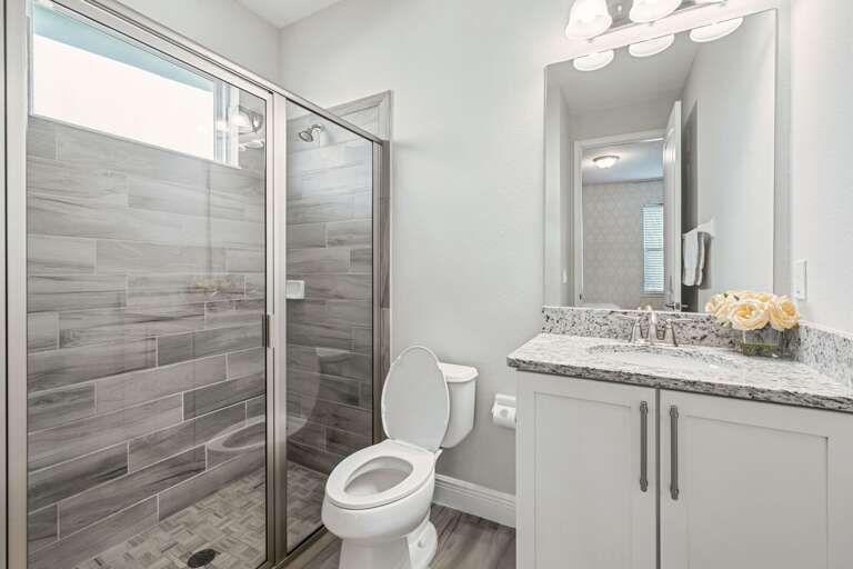 Bathroom with glass enclosed shower Bathroom with glass enclosed shower
