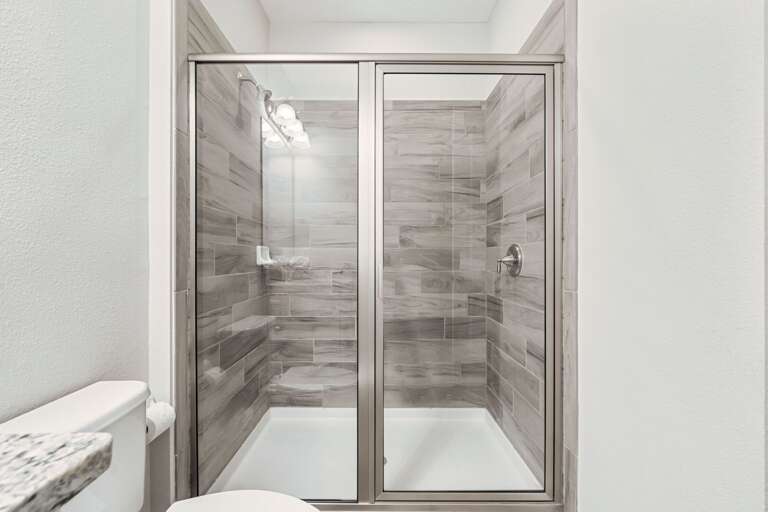 Bathroom with glass enclosed shower Bathroom with glass enclosed shower