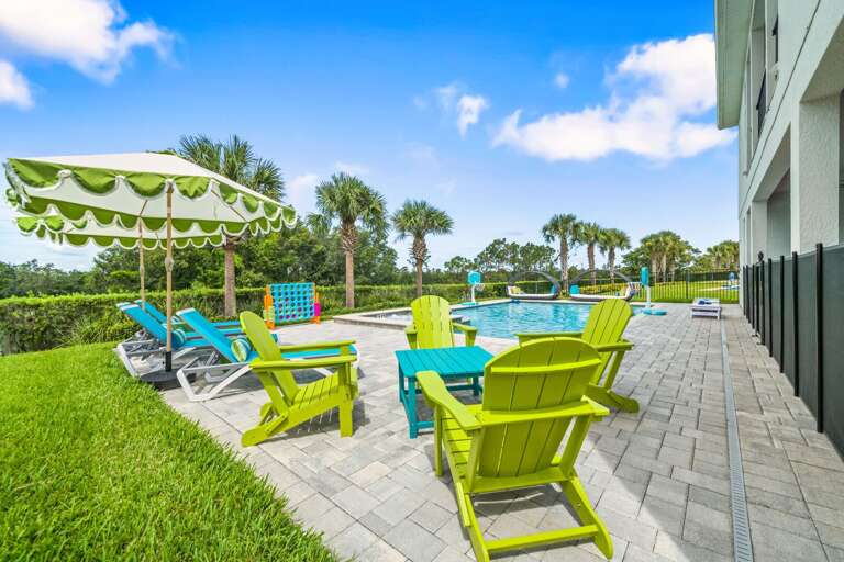 Bright and relaxing pool side lounge chairs and daybeds with huge umbrellas Bright and relaxing pool side lounge chairs and daybeds with huge umbrellas