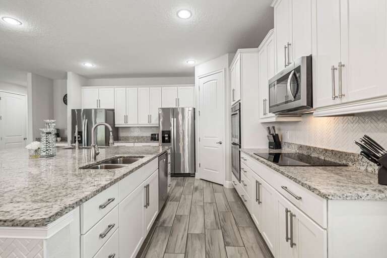 Open space kitchen with stainless steel equipments Open space kitchen with stainless steel equipments