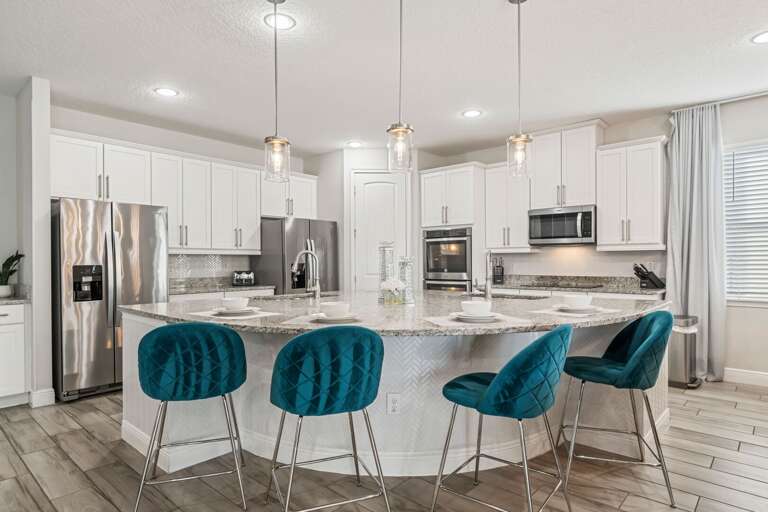 Spacious kitchen with stainless-steel appliances Spacious kitchen with stainless-steel appliances