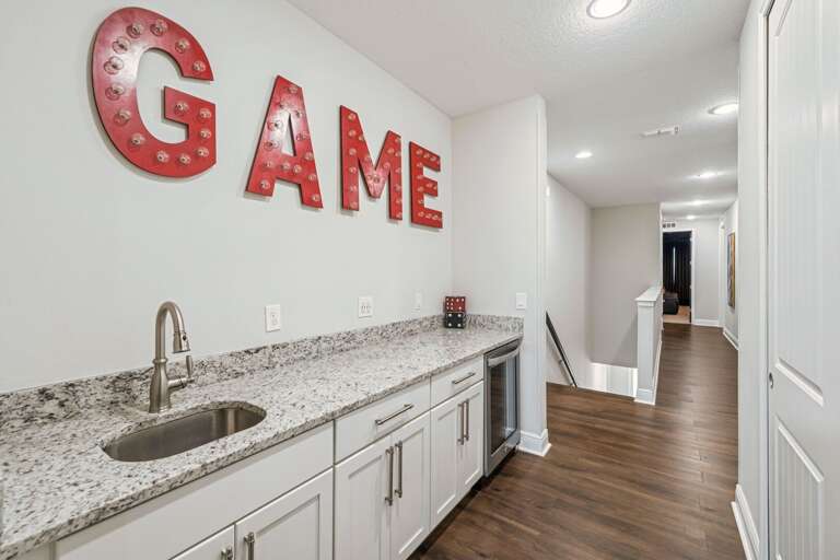 Upstairs foyer leading to more bedrooms with sink and mini fridge Upstairs foyer leading to more bedrooms with sink and mini fridge