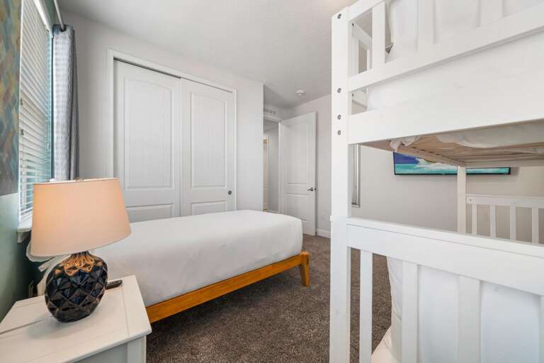 - Bright, modern bedroom with flexible sleeping arrangements
- Clean, functional design.