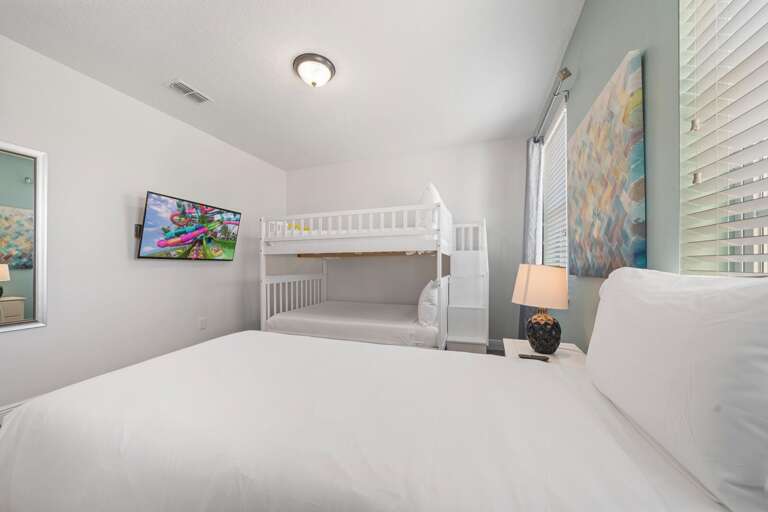 - Bright, modern bedroom with flexible sleeping arrangements
- Clean, functional design.