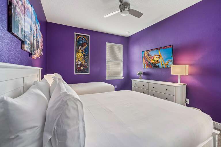 - Princess themed room
- Wrapped in soft purple hues, highlighted by crisp white wood accents.