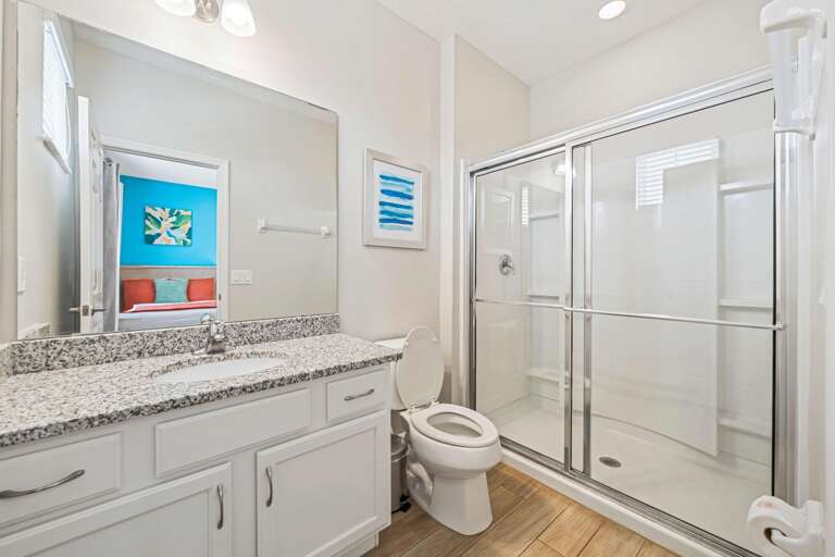 Bathroom w/ glass enclosed shower