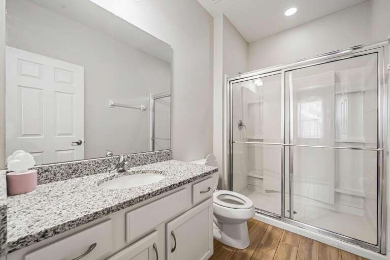 Bathroom w/ glass enclosed shower