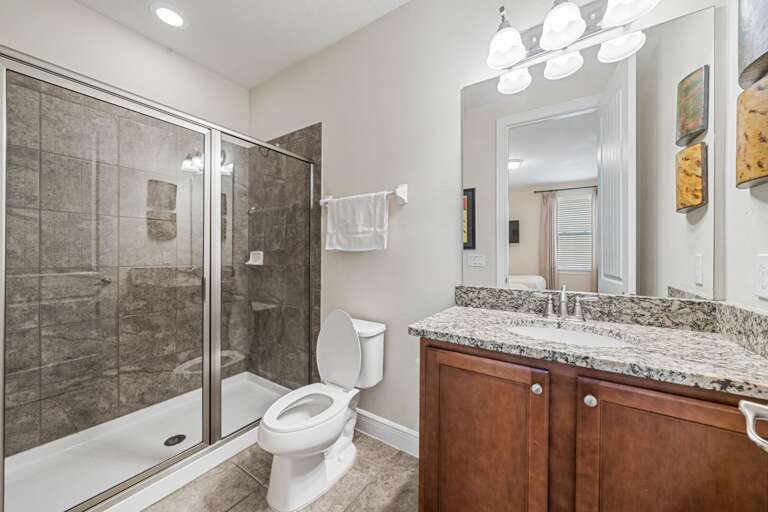 Bathroom w/ glass enclosed shower
