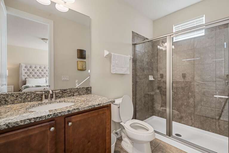 Bathroom w/ glass enclosed shower