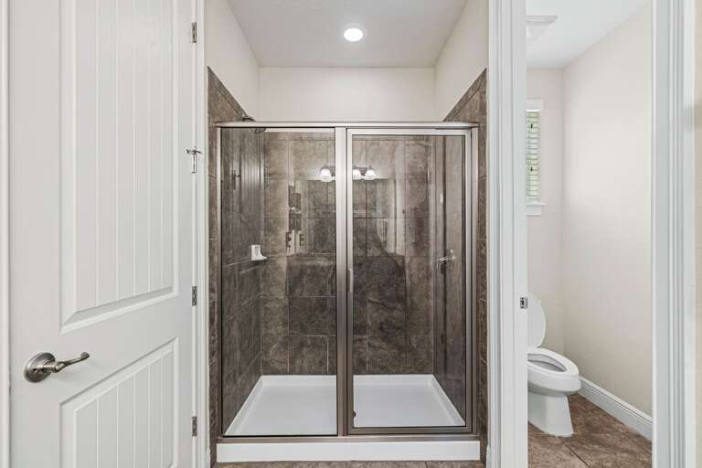 Bathroom w/ glass enclosed shower