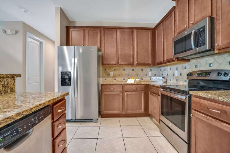Kitchen area with stainless-steel appliances.