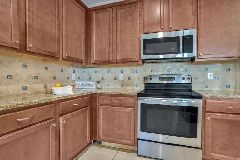 Kitchen area with stainless-steel appliances.
