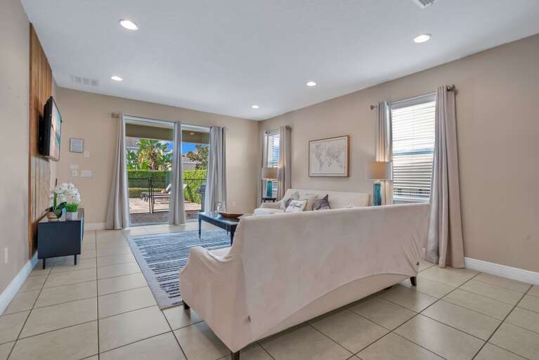 Living room with neutral tones and cozy seating.