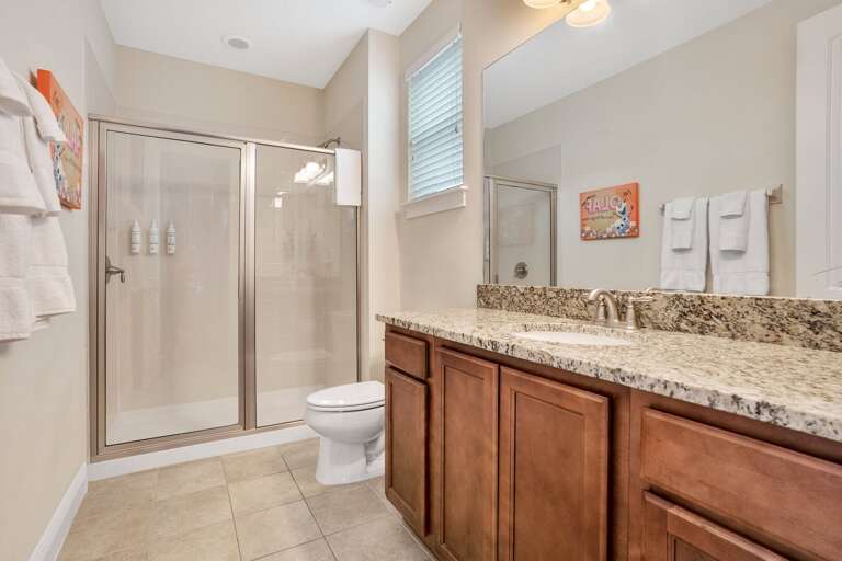Bathroom with glass enclosed shower