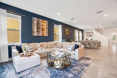 Living area with comfortable couch and large smart TV