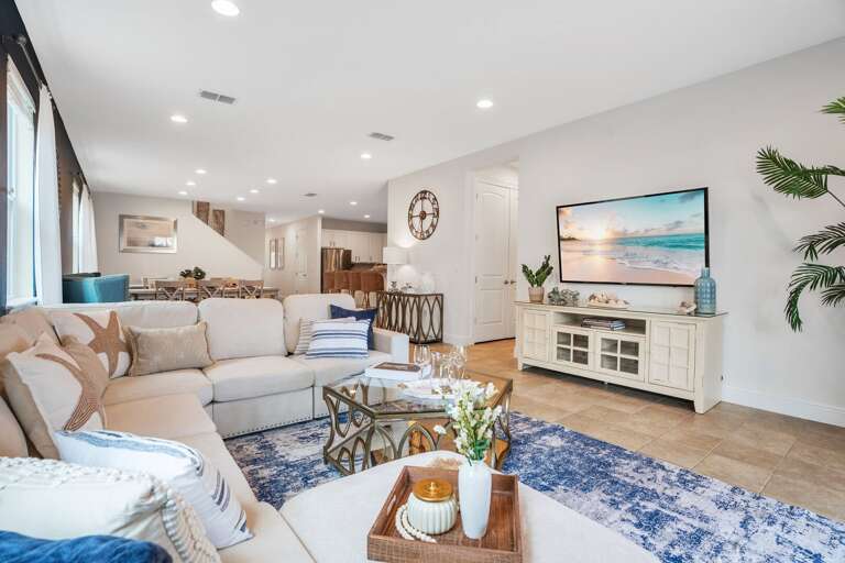 Living area with comfortable couch and large smart TV