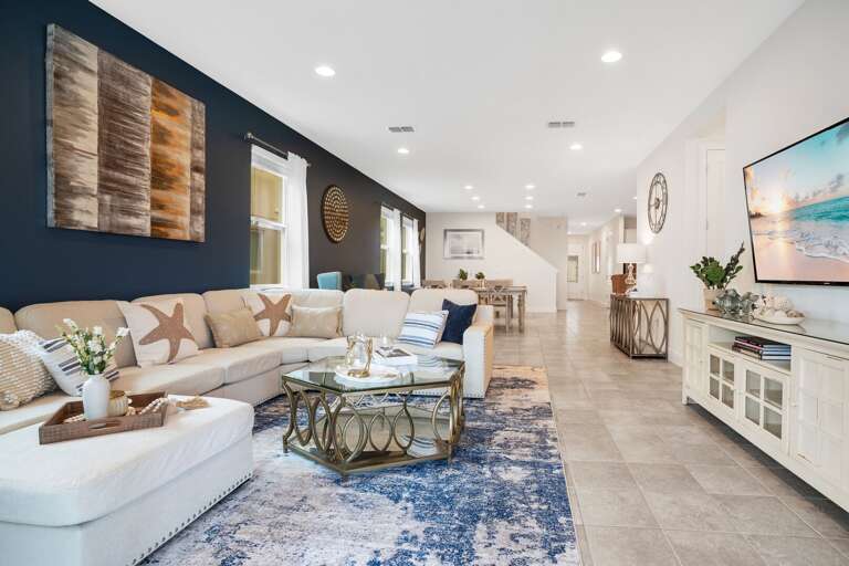 Living area with comfortable couch and large smart TV