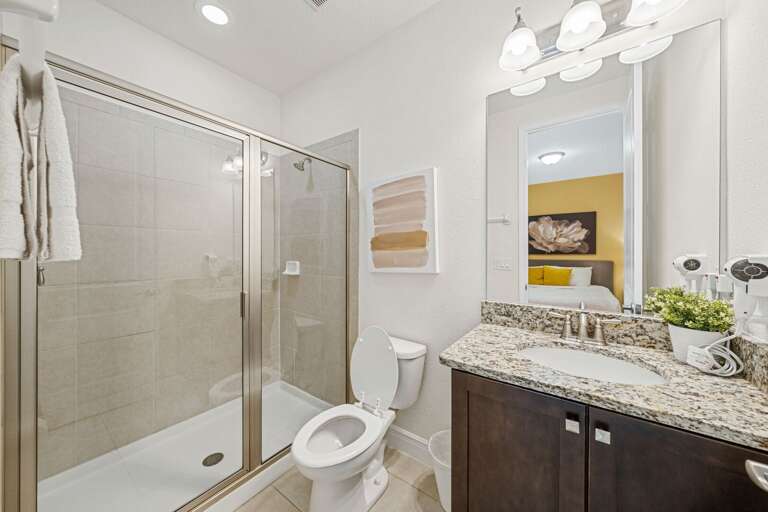 Bathroom w/ glass enclosed shower