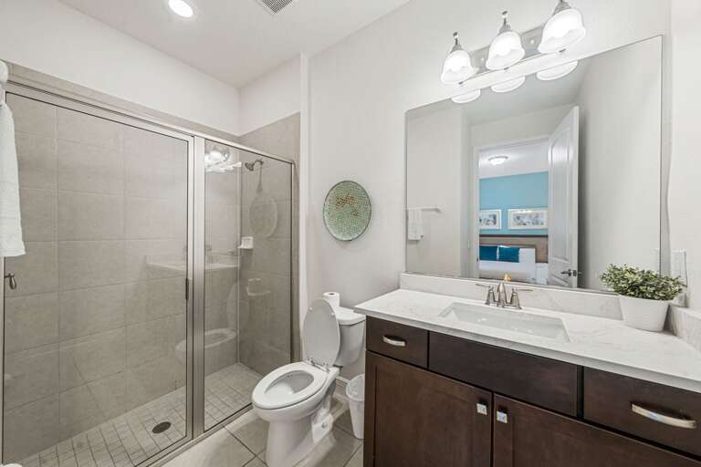Bathroom w/ glass enclosed shower