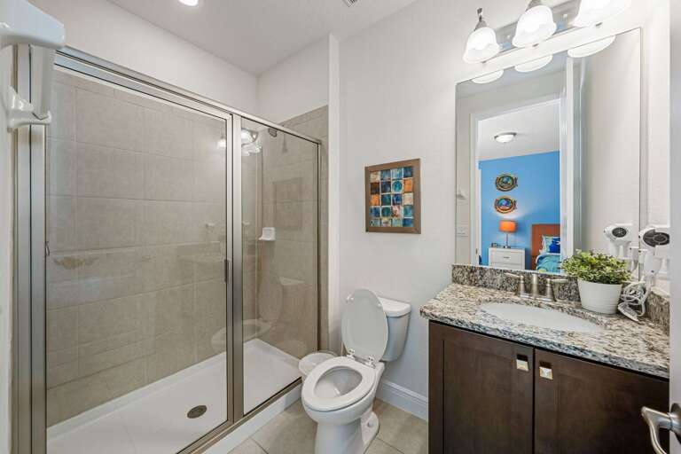 Bathroom w/ glass enclosed shower