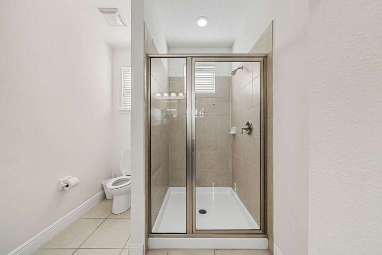 Bathroom w/ glass enclosed shower