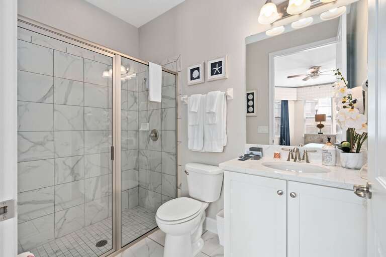 Bathroom w/ glass enclosed shower