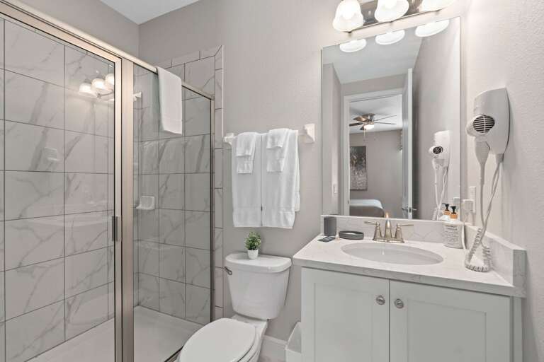 Bathroom w/ glass enclosed shower