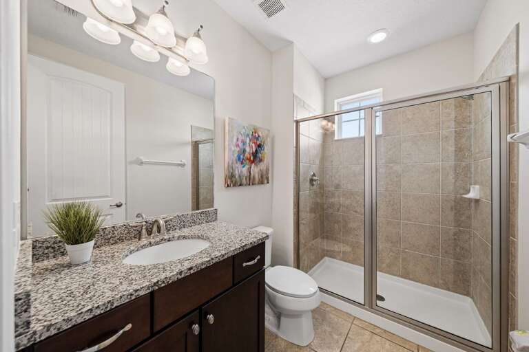 Bathroom with glass enclosed shower