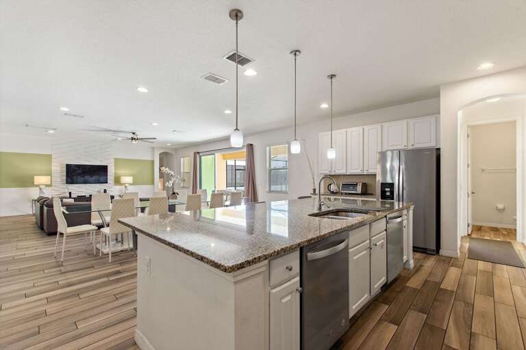 Kitchen Area w/ Stainless-steel Appliances and Large Island