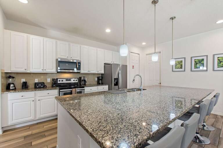 Kitchen Area w/ Stainless-steel Appliances and Large Island