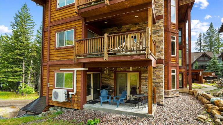 Outdoor patio features a gas grill (propane provided), and seating area for 2 and outdoor dining table for 5.