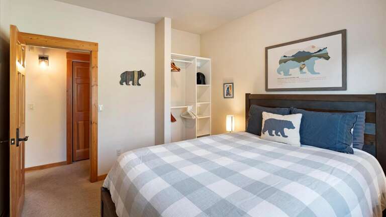 Queen room freatures a luxury mattress and linens, alpine views, and a clothing storage.
