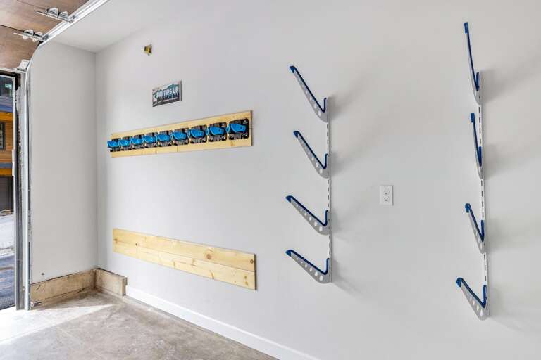Attached heated one car garage that features tons of ski and snowboard storage and industrial boot warmer system.