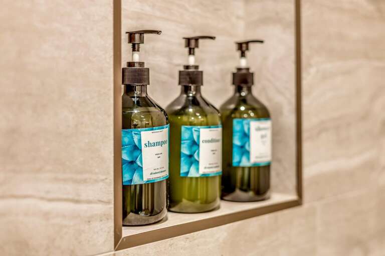 Luxury bathroom products provided for guest use in each bathroom.