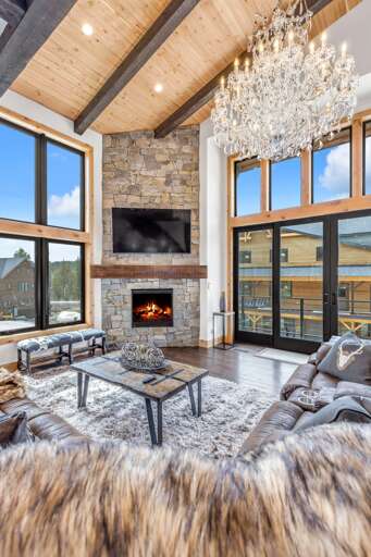 Relax on the luxury reclining sofa while enjoying the alpine views, gas fireplace, and HDTV with cable and streaming services.