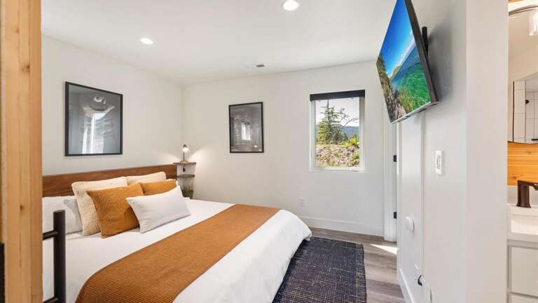 The master bedroom features a king size luxury mattress, HDTV with streaming capabilities, walk-in closet with washer
