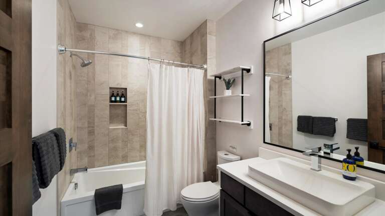 Upstairs bathroom with shower/tub combo.