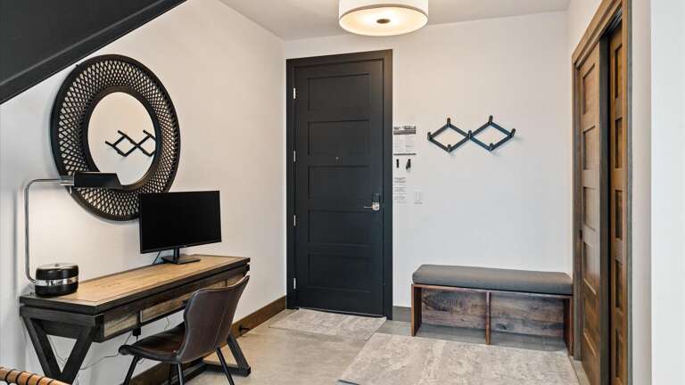 Workspace with monitor and boot storage.